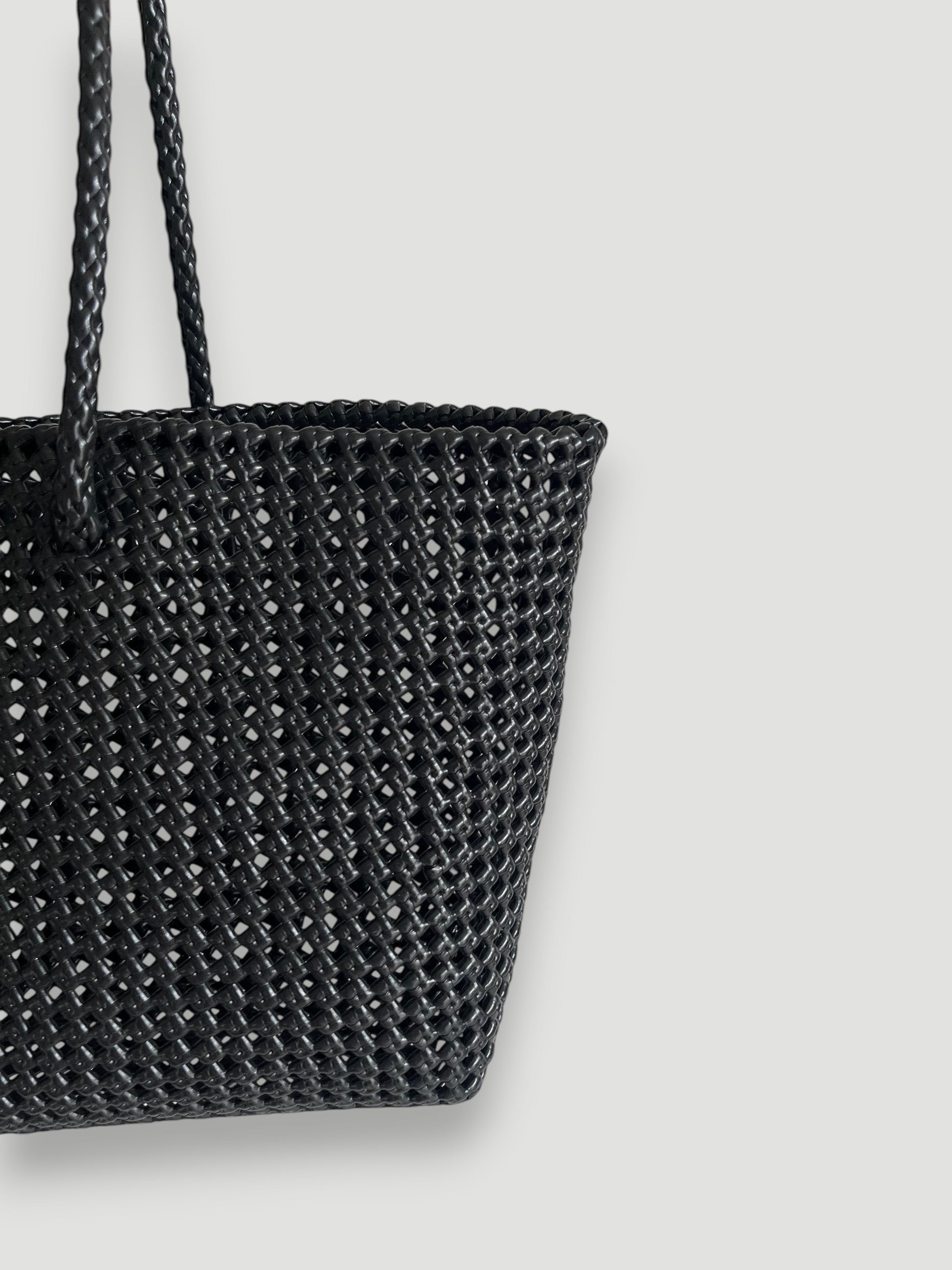 MOKA large black woven tote bag made from recycled plastic and silk with braided handles. Handmade and durable.